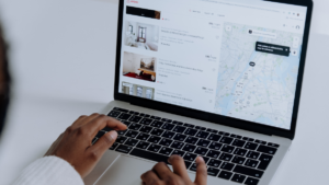 Person using a laptop to manage a small business website and online services